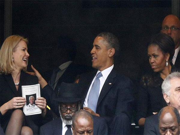 باراك اوباما وزوجته في جنازة مانديلا